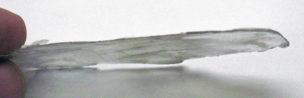 Muscovite mica book showing the edges of many stacked cleavage sheets