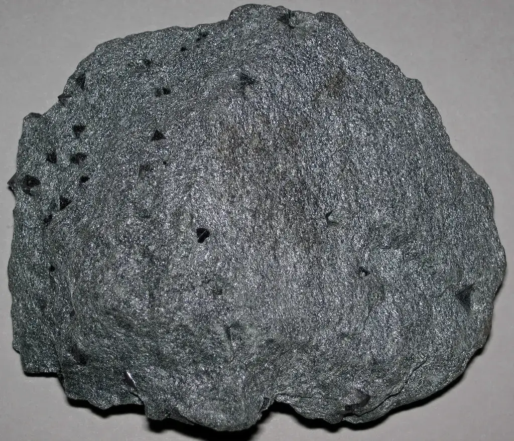 Grey-green chlorite schist studded with small black octahedral magnetite crystals, Vermont