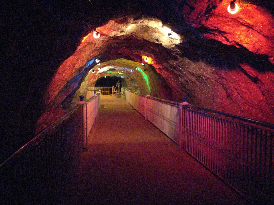Interior of Khewra Salt Mine showing pink and red halite walls along an underground passageway