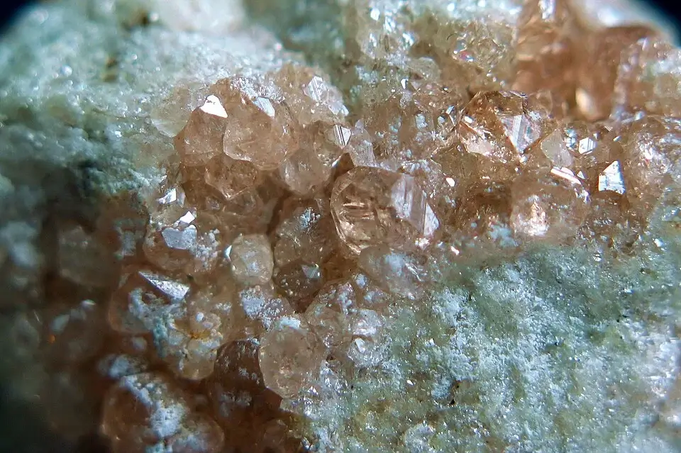 Lustrous orange-green grossular garnet crystals on a pale matrix from Asbestos, Quebec