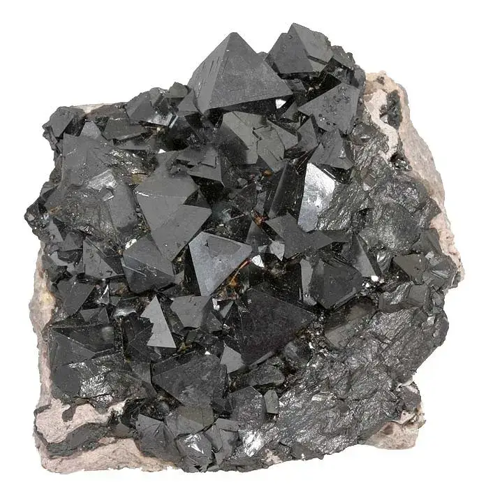 Sharp black octahedral magnetite crystals on cream-coloured feldspar from Cerro Huañaquino, Bolivia