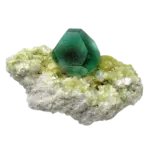 Green fluorite crystal on yellow mineral matrix