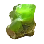 Vivid green translucent mineral olivine crystal on rock matrix