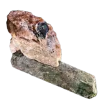 Pink mineral crystal resting on a green stone prism (apatite)