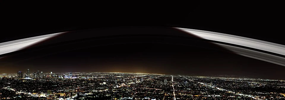 Artist visualization of an Earth ring system arcing over a city skyline, illustrating the Ordovician ring hypothesis