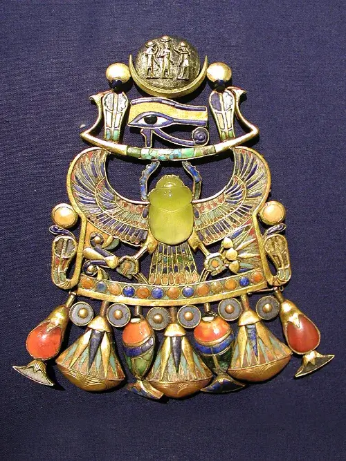 Tutankhamun's pectoral with the central winged scarab carved from yellow Libyan Desert Glass, set in gold with inlaid lapis, carnelian, and turquoise