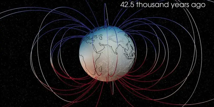 Visualization still of Earth's magnetic field during the Laschamp excursion, with blue patches showing where field lines enter the surface and red patches showing where they exit, illustrating a multi-pole configuration