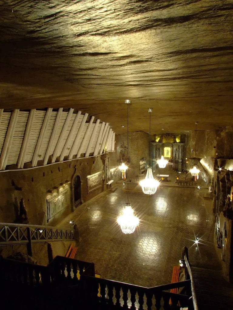 St. Kinga's Chapel deep inside the Wieliczka Salt Mine, a large underground hall with carved salt altarpieces and chandeliers made from salt crystals.