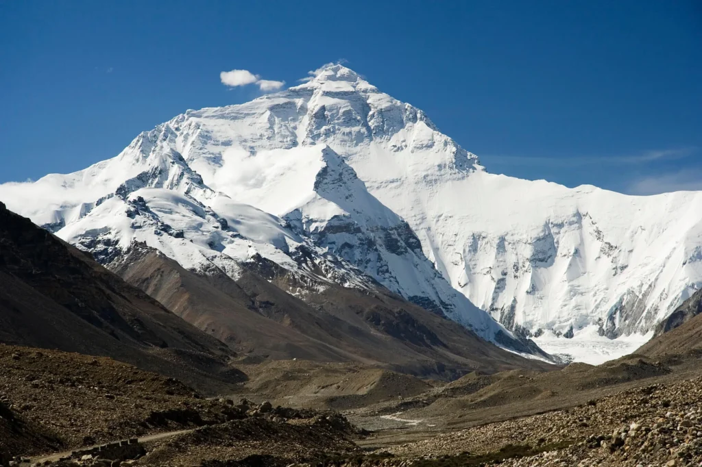 The north face of Mount Everest, with the pale grey summit limestone above the darker metamorphic Yellow Band that holds marine fossils.