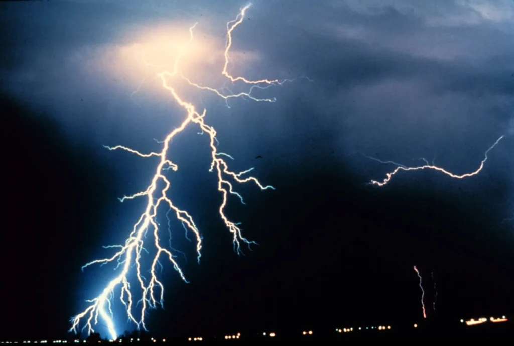 Multiple cloud-to-ground lightning strokes during a night-time thunderstorm, the ordinary storm electricity most often mistaken for earthquake lights