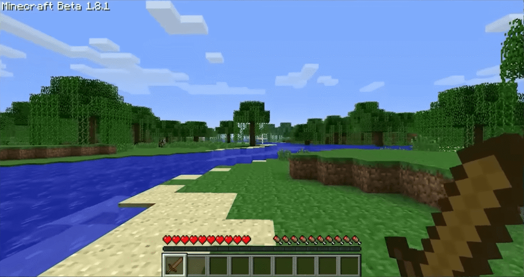 Minecraft gameplay screenshot showing a generated landscape of grass, water, and blocky hills