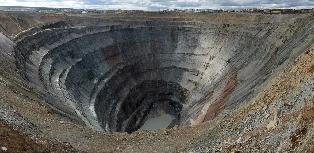 Aerial view of the vast circular Mir kimberlite diamond mine pit in Yakutia, Siberia
