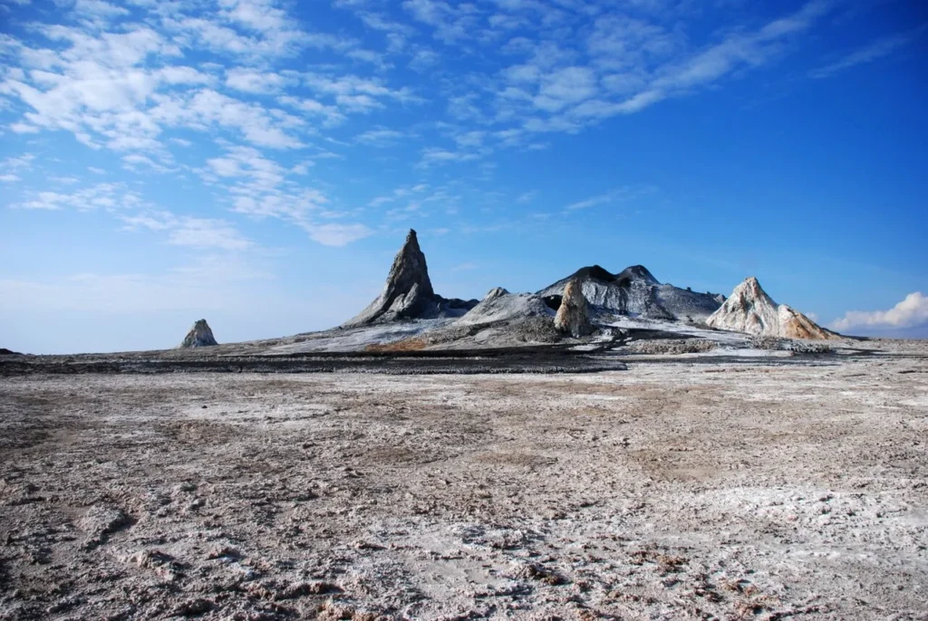 The crater of Ol Doinyo Lengai with a fresh black natrocarbonatite lava flow surrounded by older, chalk-white weathered lava
