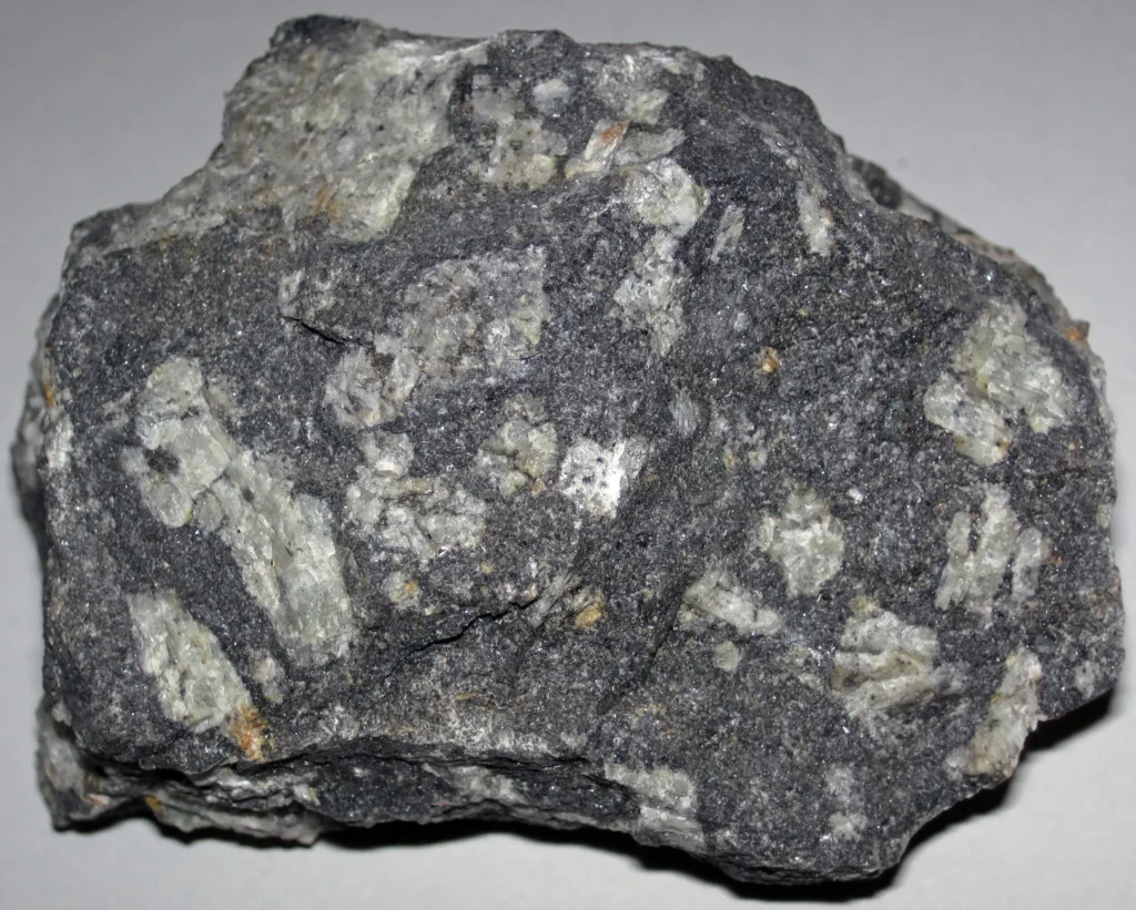 Close-up of a diabase hand specimen showing pale plagioclase feldspar crystals set in a dark, fine-grained groundmass of pyroxene