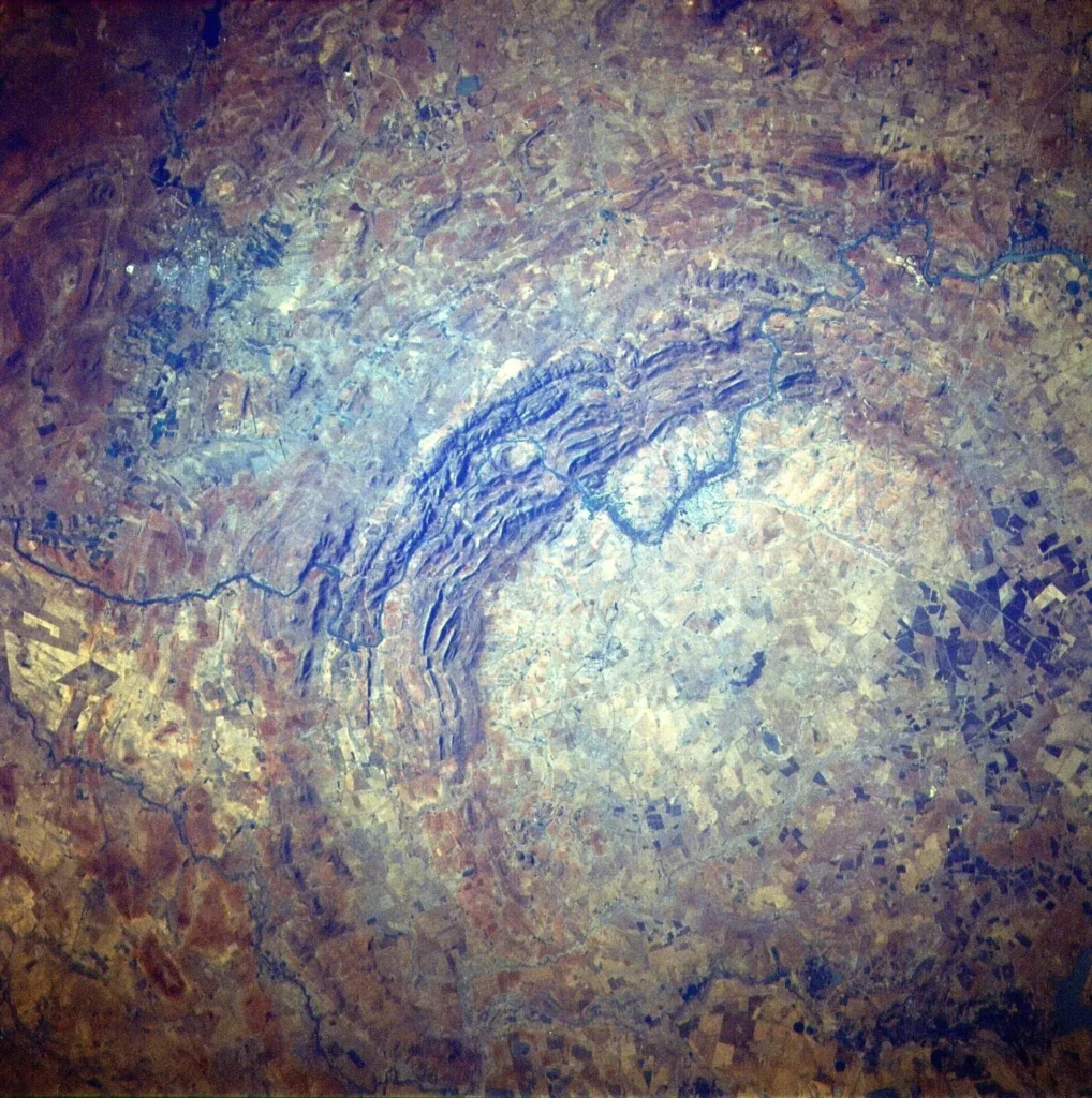 Photograph of the Vredefort Dome taken from Space Shuttle Discovery in 1985 showing the semicircular ring of hills