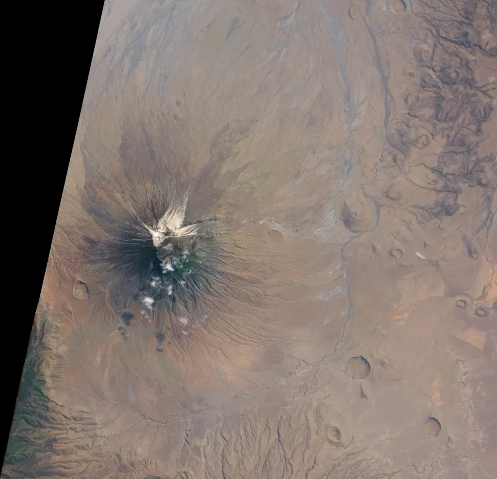  Satellite image of Ol Doinyo Lengai's summit in 2009, showing a new steep-walled cone and deep crater surrounded by gray ash after the 2007–2008 explosive eruptions.