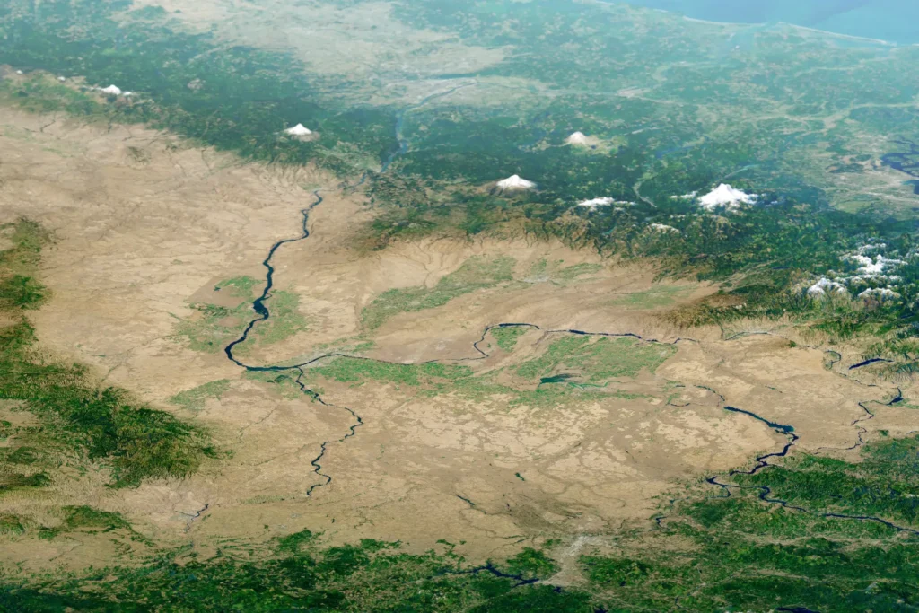 Satellite render of the Channeled Scablands showing a branching network of dark flood channels carved into the basalt plateau of eastern Washington, draped over 3D topography.