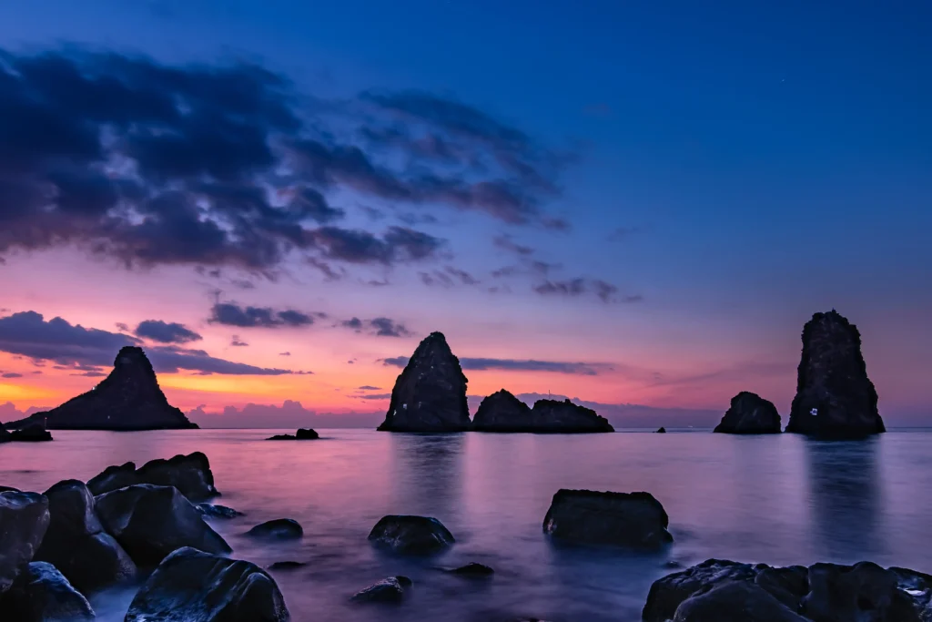 Faraglioni dei Ciclopi, volcanic sea stacks off Aci Trezza, Sicily, linked in legend to the Cyclops Polyphemus