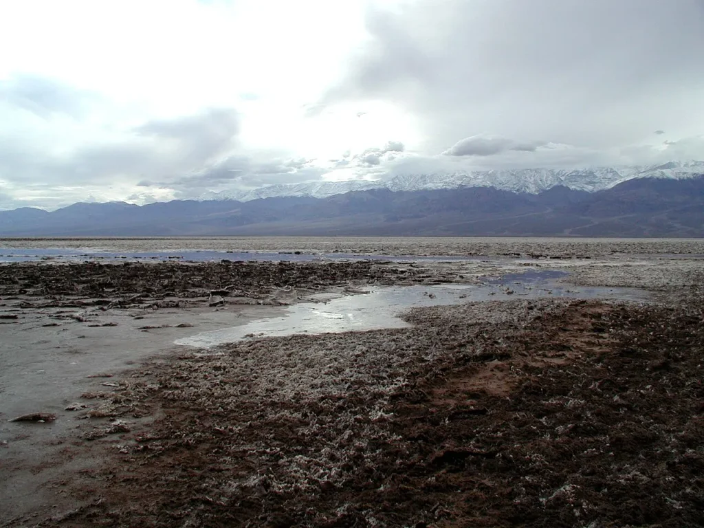 Salt flats of Death Valley, California, with mountains in the distance