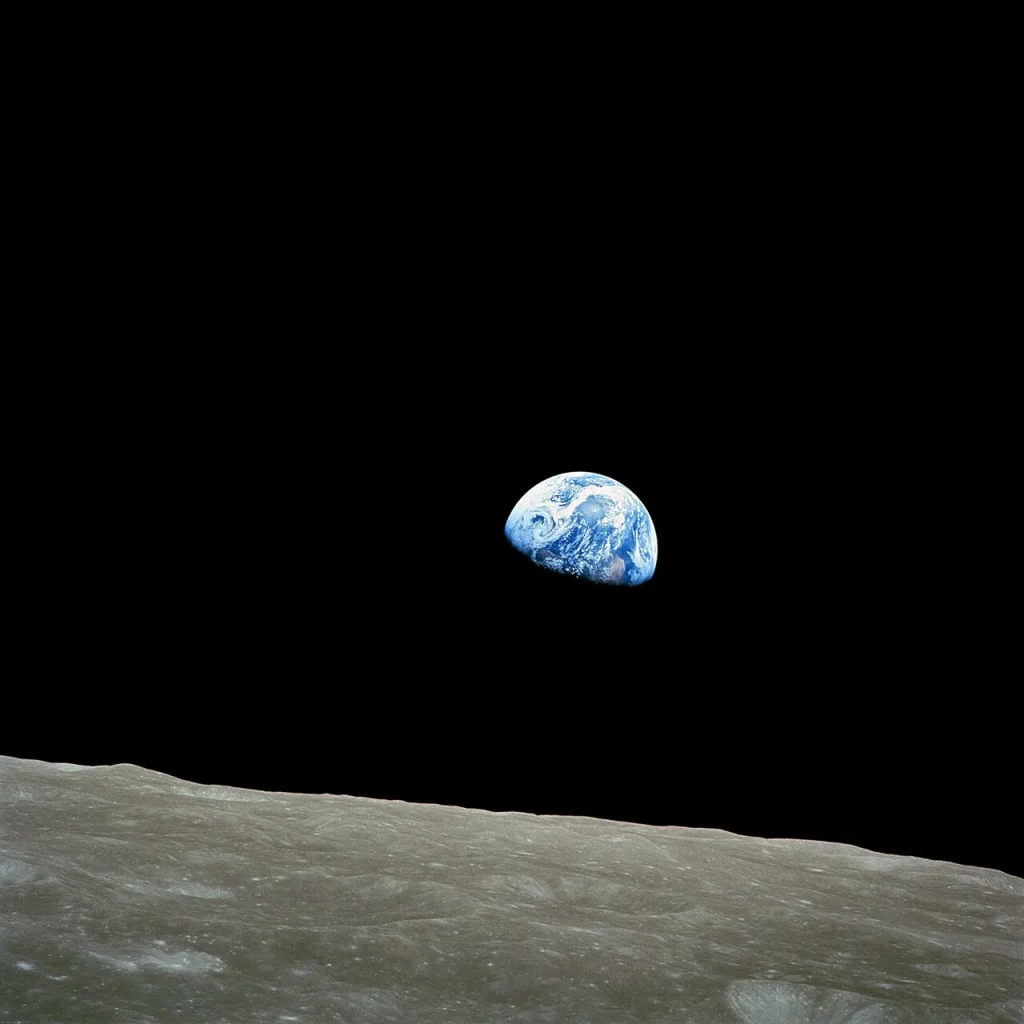 Earthrise: Earth rising over the lunar horizon, photographed from Apollo 8 in December 1968