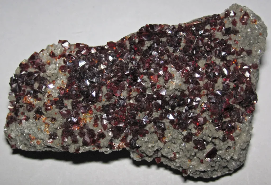 Dark red sphalerite crystals sitting on pale grey dolostone from the Millersville Quarry in Sandusky County, Ohio