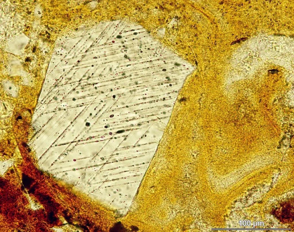 Photomicrograph of shocked quartz with planar deformation features