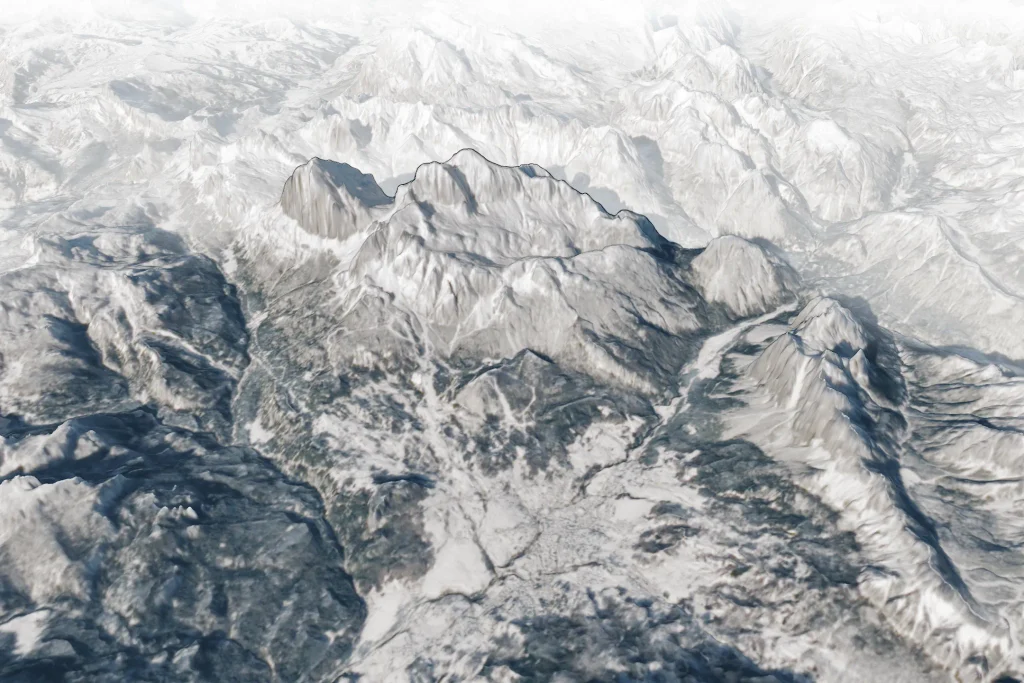Three-dimensional satellite view of snow-covered peaks of the Dolomites rising above the town of Cortina d'Ampezzo, with Tofana di Mezzo labelled