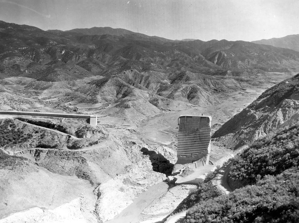 The lone standing center section of the collapsed St. Francis Dam, with the scoured canyon walls on either side
