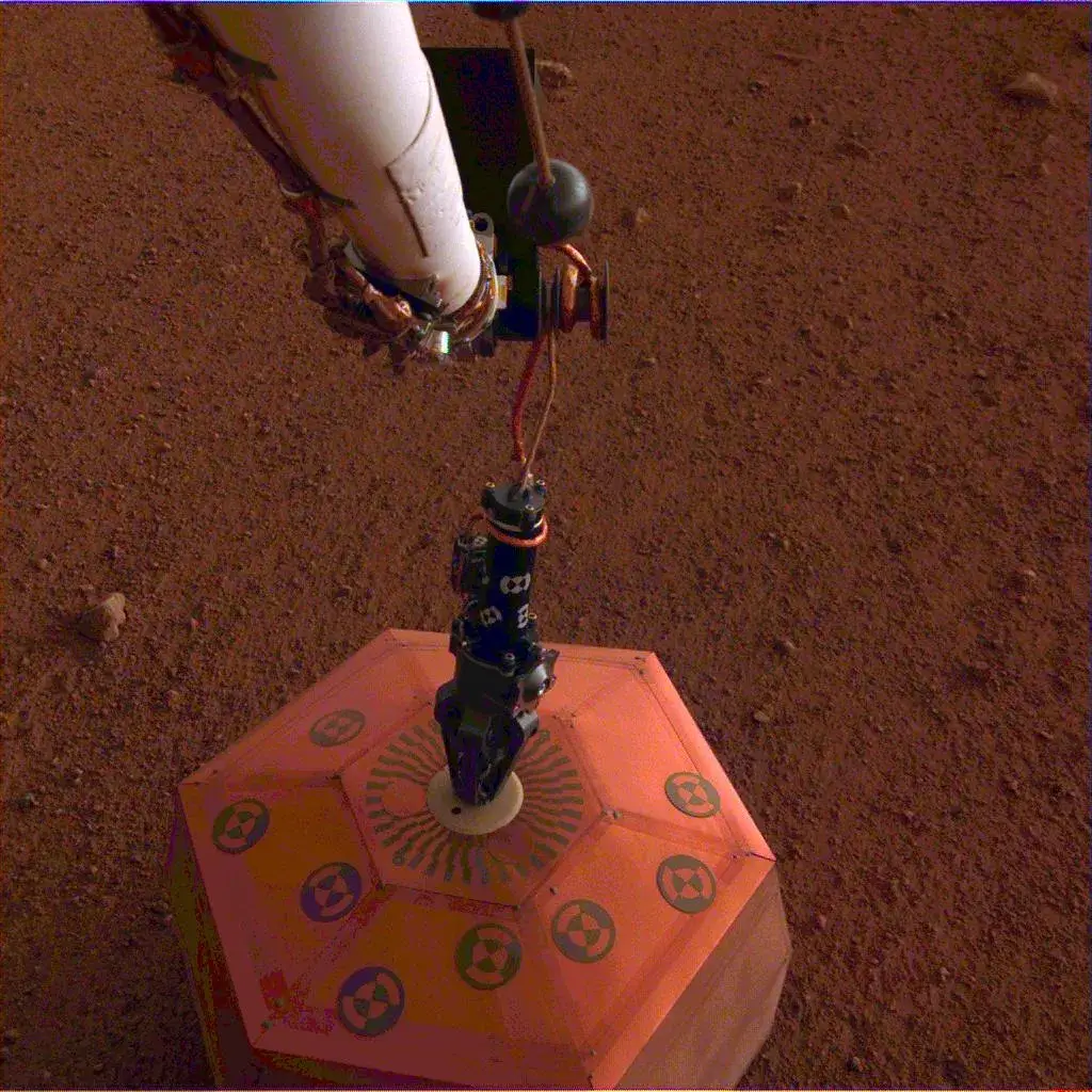 NASA InSight lander's dome-covered SEIS seismometer deployed on the surface of Mars to study the planet's interior